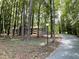 Charming one-story home with a newly built deck nestled among mature trees at 102 Pebble Ct, Chapel Hill, NC 27516