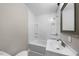 Bathroom with tub/shower combination, white tile, and single sink vanity at 104 Archdale Dr, Durham, NC 27707