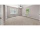 Bedroom with neutral carpet, base molding, and natural light from windows at 104 Archdale Dr, Durham, NC 27707