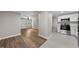 Open concept kitchen and living room with hardwood floors and modern appliances at 104 Archdale Dr, Durham, NC 27707