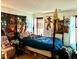Bedroom featuring a four poster bed and unique decor at 104 Fox Trail Ln, Morrisville, NC 27560