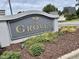 Elegant community sign 'The Groves at Morrisville' surrounded by lush landscaping, welcoming residents at 104 Fox Trail Ln, Morrisville, NC 27560