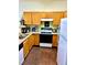 Functional kitchen with laminate countertops, stainless sink, and ample cabinet space at 104 Fox Trail Ln, Morrisville, NC 27560