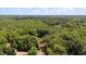 An aerial view of a home surrounded by green trees at 106 Nations Cove, Louisburg, NC 27549