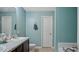 Bright bathroom featuring a double vanity, granite counters, with a toilet and tub at 106 Nations Cove, Louisburg, NC 27549