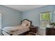 Comfortable bedroom showcasing a stylish bed and dresser at 106 Nations Cove, Louisburg, NC 27549