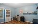Cozy bedroom featuring a workspace, a wine cooler and custom shelving for extra storage at 106 Nations Cove, Louisburg, NC 27549