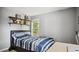 Bright bedroom featuring natural light, perfect for relaxation at 106 Nations Cove, Louisburg, NC 27549