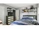 Comfortable bedroom with stylish shelving and storage at 106 Nations Cove, Louisburg, NC 27549