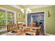 Dining room featuring a tray ceiling, wainscotting, and views to other rooms at 106 Nations Cove, Louisburg, NC 27549