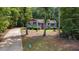A charming home with well-maintained lawn and driveway at 106 Nations Cove, Louisburg, NC 27549