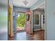 Bright foyer with wood floors and a colorful front door that brings in natural light at 106 Nations Cove, Louisburg, NC 27549