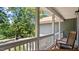 Inviting front porch with a rocking chair, offering a relaxing outdoor space at 106 Nations Cove, Louisburg, NC 27549