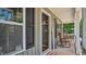 View of the spacious front porch with rocking chairs, plants, and decorative accents at 106 Nations Cove, Louisburg, NC 27549
