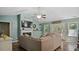 Inviting living room with a fireplace, large sofa, and access to the outdoor patio at 106 Nations Cove, Louisburg, NC 27549