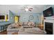 Spacious living room features an oversized couch, brick fireplace, and hardwood floors throughout at 106 Nations Cove, Louisburg, NC 27549