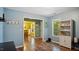 Open-concept living room with wood floors and natural light at 106 Nations Cove, Louisburg, NC 27549