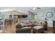 Inviting living room features an oversized couch, and an open layout to the kitchen at 106 Nations Cove, Louisburg, NC 27549