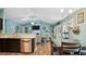 Living area with kitchen view, offering a modern layout with a dining area and ample natural light at 106 Nations Cove, Louisburg, NC 27549