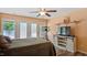 Comfortable bedroom featuring a television, shelving, and access to a private patio at 106 Nations Cove, Louisburg, NC 27549