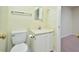 Modest bathroom featuring a toilet, sink, and mirrored vanity at 107 Ashley Forest Rd # B, Chapel Hill, NC 27514