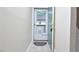 Hallway view of exterior door with glass window and grey rug at 107 Ashley Forest Rd # B, Chapel Hill, NC 27514