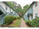 Apartment building exterior featuring painted siding, green trim, and stairs to the second level at 107 Ashley Forest Rd # B, Chapel Hill, NC 27514