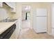 Open concept kitchen with view to living room and outdoor deck at 107 Ashley Forest Rd # B, Chapel Hill, NC 27514