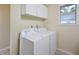 Bright laundry room showcasing a modern washer and dryer next to a window at 107 Ashley Forest Rd # B, Chapel Hill, NC 27514
