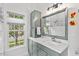 Bright bathroom with shaker cabinets, quarts counters, and lots of natural light at 107 Regiment Way, Durham, NC 27705