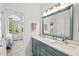 A shared sink vanity with quartz countertop stands out in this bathroom, with a bedroom visible through the doorway at 107 Regiment Way, Durham, NC 27705