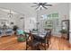 Dining room featuring hardwood floors, a large window, and stylish decor at 107 Regiment Way, Durham, NC 27705
