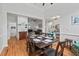 Spacious dining room open to living area, featuring hardwood floors and contemporary decor at 107 Regiment Way, Durham, NC 27705
