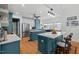 Open-concept kitchen boasts dual islands, seating, and modern finishes at 107 Regiment Way, Durham, NC 27705