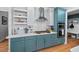 Well-equipped kitchen features stainless steel appliances, tiled backsplash, and custom cabinetry at 107 Regiment Way, Durham, NC 27705