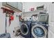 Laundry room featuring side-by-side washer and dryer, overhead cabinets, and decor at 107 Regiment Way, Durham, NC 27705