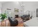 Bright living room with vaulted ceiling, fireplace, hardwood floors, and comfortable seating area at 107 Regiment Way, Durham, NC 27705