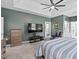 Bright and airy main bedroom with a tray ceiling, ceiling fan, and lots of closet space at 107 Regiment Way, Durham, NC 27705