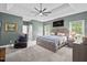 Spacious main bedroom suite with tray ceilings, a ceiling fan, and lots of natural light at 107 Regiment Way, Durham, NC 27705