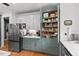 Kitchen with stainless steel appliances and well-organized pantry at 107 Regiment Way, Durham, NC 27705