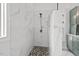 Walk-in shower with marble tile, modern fixtures, and great natural light at 107 Regiment Way, Durham, NC 27705
