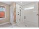 Bathroom featuring walk-in shower with dual shower heads and tile surround at 108 Ripplewater Ln, Cary, NC 27518