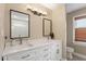 Bathroom vanity with double sinks, modern lighting, and framed mirrors at 108 Ripplewater Ln, Cary, NC 27518