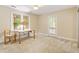 Cozy bedroom with a large window for natural light and neutral carpeting throughout at 108 Ripplewater Ln, Cary, NC 27518