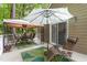 Outdoor living space with gazebo, lounge furniture and an umbrella at 108 Ripplewater Ln, Cary, NC 27518