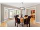 Dining room featuring a bay window and designer chandelier at 108 Ripplewater Ln, Cary, NC 27518