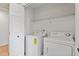 Convenient laundry room with washer, dryer and shelving at 108 Ripplewater Ln, Cary, NC 27518