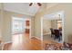 Open living room showcasing views of the kitchen and dining areas and hardwood floors at 108 Ripplewater Ln, Cary, NC 27518