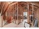 Attic area with exposed wood framing and a view of the unfinished storage area at 109 Big Timber Path, Holly Springs, NC 27540