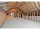 Unfinished attic space with wood framing, ready for customization and storage at 109 Big Timber Path, Holly Springs, NC 27540